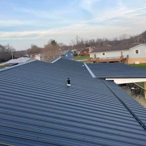 Close up of the top of a black metal roof.